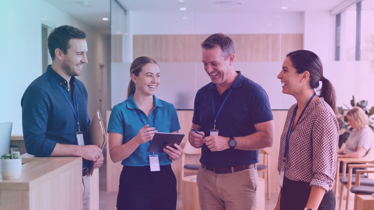 4 therapists standing and smiling in a clinic